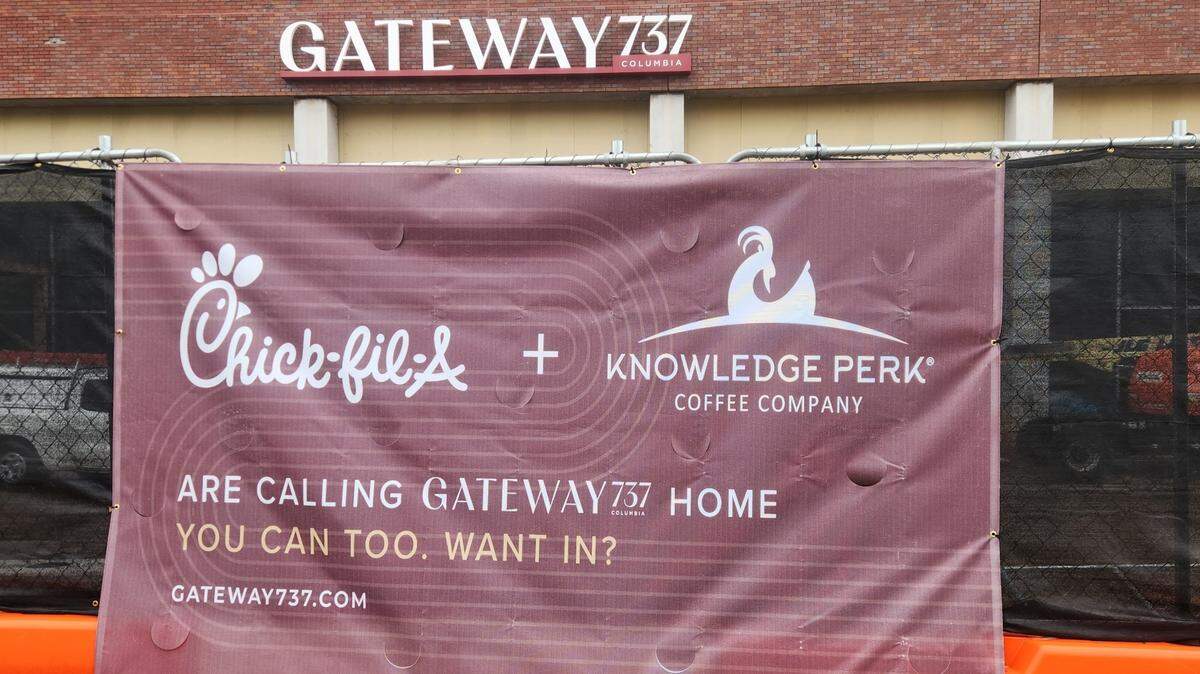 A sign notes that Chick-fil-A and Knowledge Perk Coffee will be part of the Gateway 737 student housing project next door to Colonial Life Arena.