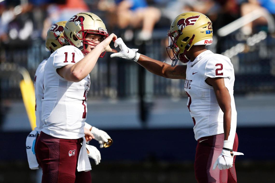 Erskine receiver Javian Bellamy wide receiver (2) celebrates his touchdown with Erskine quarterback Craig Pender (11) in the first quarter Saturday.