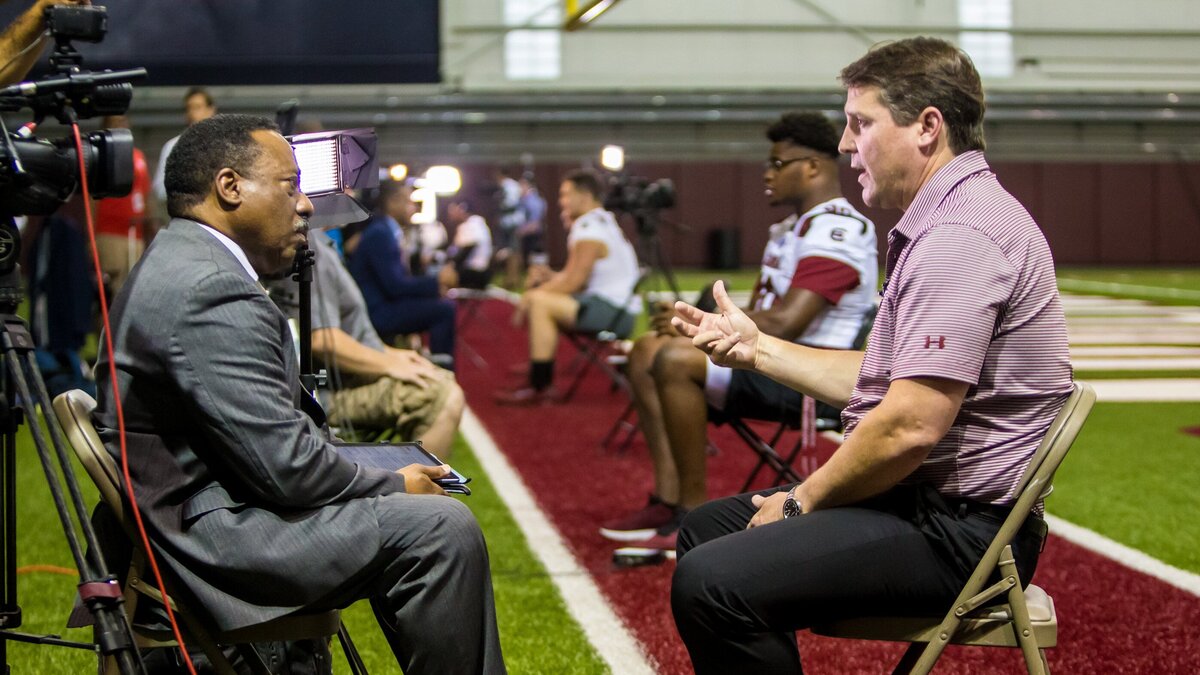 Head coach Will Muschamp is interviewed by Rick Henry of WIS during the University of South Carolina Media Day.