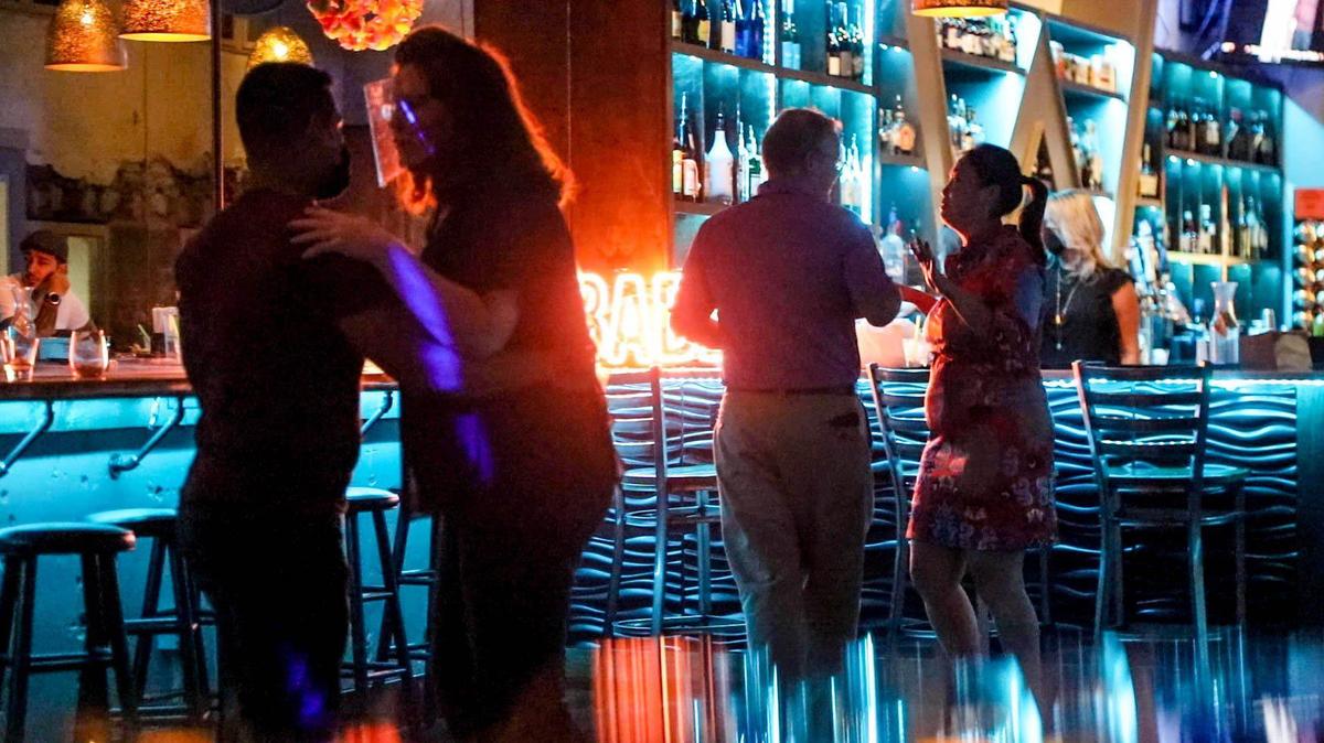 Couples dance at The Woody on Main for Salsa night on August 19, 2020. The dance club will close at the end of October. 