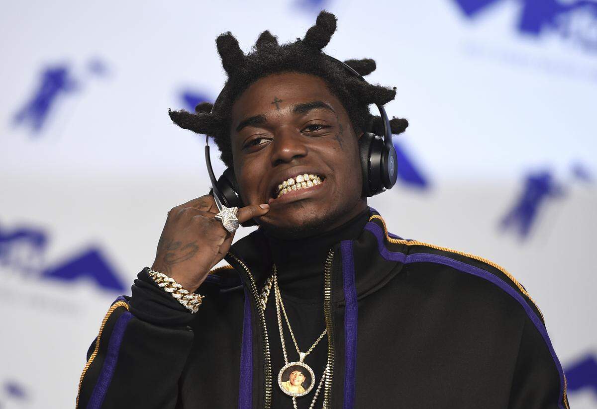 FILE - In this Aug. 27, 2017 file photo, Kodak Black arrives at the MTV Video Music Awards at The Forum in Inglewood, Calif. New York state police say rapper Kodak Black was arrested on drug and weapons charges as he tried to cross from Canada into the United States near Niagara Falls. Police say Bill Kapri, whose stage name is Kodak Black, was among three people attempting to enter the United States in a Cadillac Escalade on Wednesday, April 18, 2019.  Black, who was driving, was found with marijuana and officers discovered a Glock 9mm pistol in the vehicle. (Photo by Jordan Strauss/Invision/AP, File)