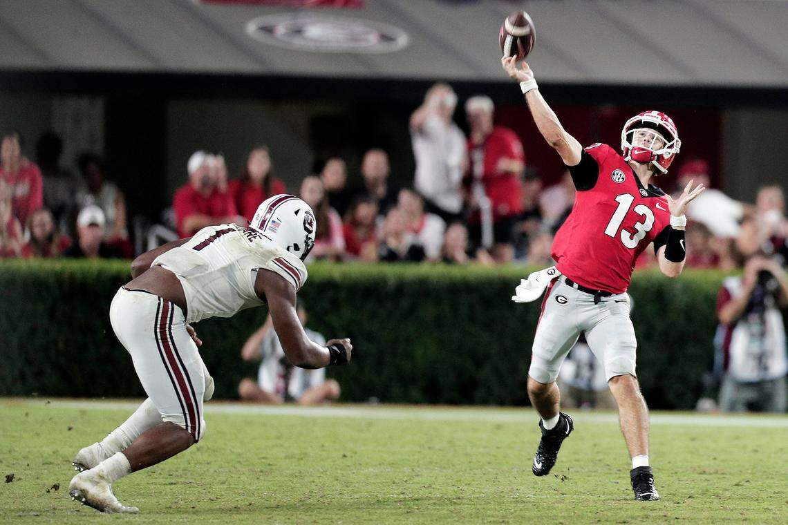 South Carolina Gamecocks defensive end Kingsley Enagbare (1) does not tackle Georgia Bulldogs quarterback Stetson Bennett (13) at Sanford Stadium on Saturday, September 18, 2021.
