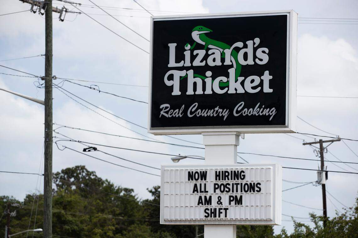 A sign at The Lizard Thicket on Elmwood avenue in Columbia, South Carolina advertises open positions on Friday, August 27, 2021. In order to hold onto managers, operations manager Matthew Williams says he has given managers a 10% raise and made the new minimum wage at his restaurants $10 an hour.