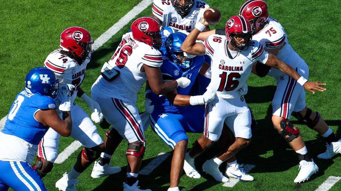 South Carolina Gamecocks quarterback LaNorris Sellers (16) gets a pass off under pressure from Kentucky Wildcats defensive lineman Tre’vonn Rybka (90) during a football game against South Carolina Saturday, Sept. 7, 2024 at Kroger Field in Lexington, Ky.