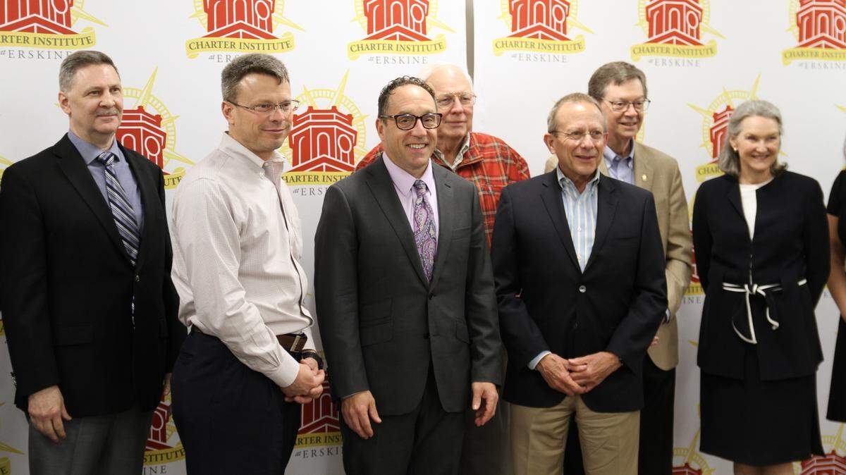 Officials with the Charter Institute at Erskine gathered for the opening of a new charter school in April 2024. Derec Shuler, executive director of Ascent Classical Academies, is second from left.
