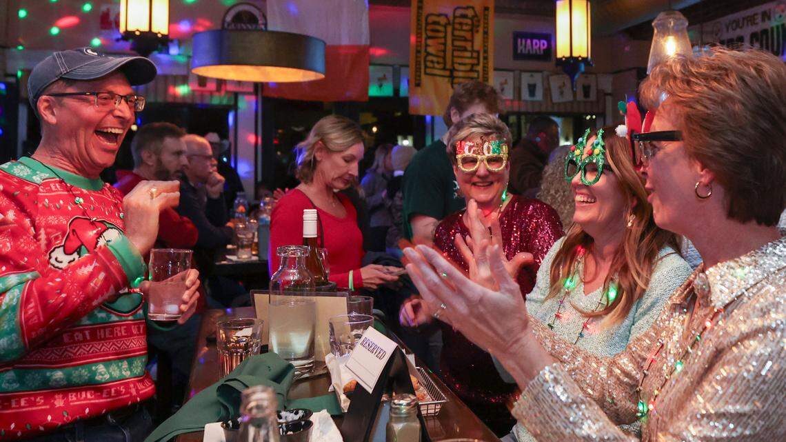 Edel Mobley, left, and Diane Kahaly, from right, Diane Clyburn and Elizabeth Beutel-Mobley enjoy the festive environment at O’Hara’s Public House on Lexington’s Main Street on Friday Dec. 6, 2024.