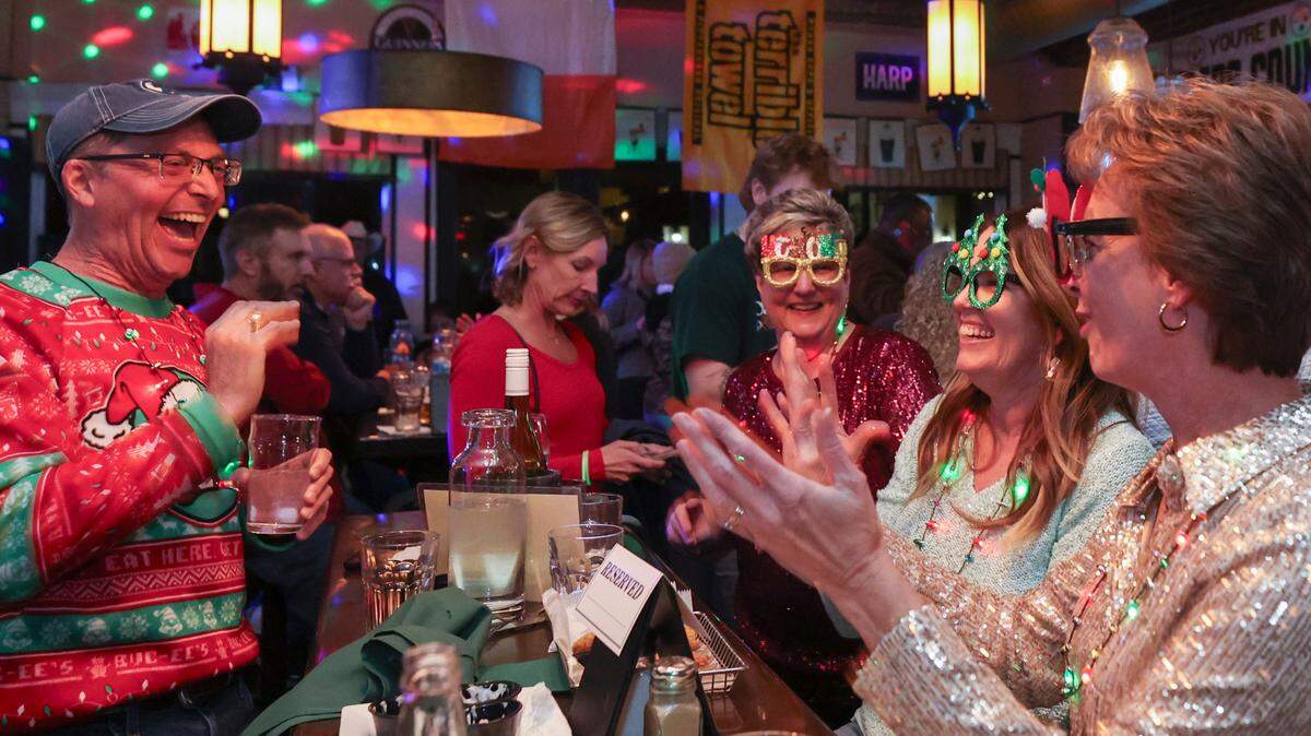 Edel Mobley, left, and Diane Kahaly, from right, Diane Clyburn and Elizabeth Beutel-Mobley enjoy the festive environment at O’Hara’s Public House on Lexington’s Main Street on Friday Dec. 6, 2024.