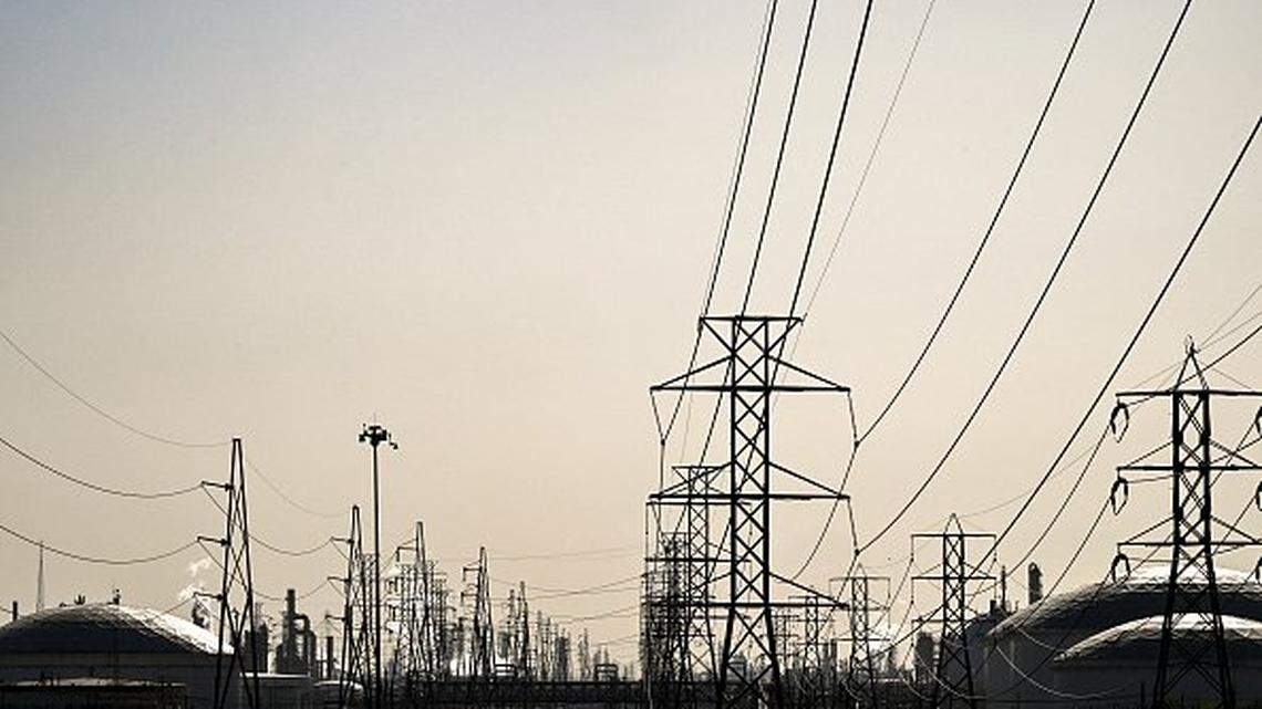 Overheard power lines and the PEMEX Deer Park oil refinery are seen on April 8, 2025, in Deer Park, Texas. Stock markets and oil prices bounced higher on Tuesday following a huge sell-off, but analysts warned of more turmoil as US President Donald Trump charges ahead in his escalating trade war. After trillions of dollars were wiped from the combined value of global equity markets since last week, share prices across the globe clawed back some ground as investors assessed the possibility of Washington tempering some of the levies. (Photo by RONALDO SCHEMIDT / AFP) (Photo by RONALDO SCHEMIDT/AFP via Getty Images)          