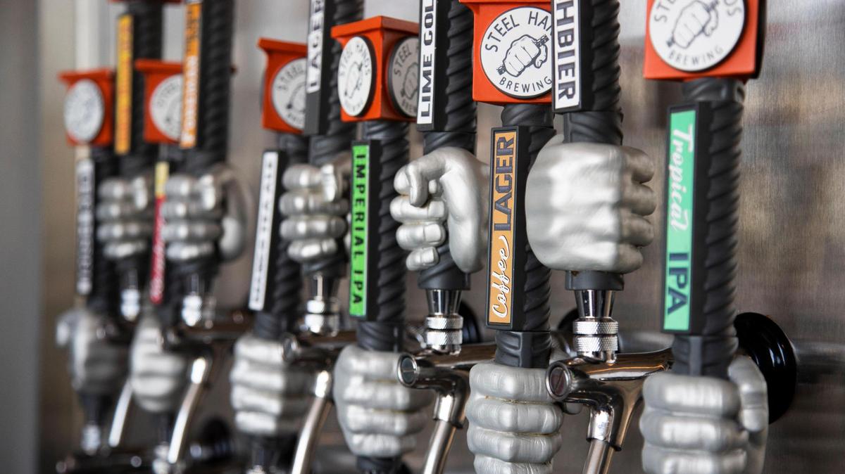 People and their dogs enjoy live music and beer at Steel Hands Brewing in Cayce, South Carolina on Friday, June 18, 2021. Dogs are welcome in their outdoor seating areas.