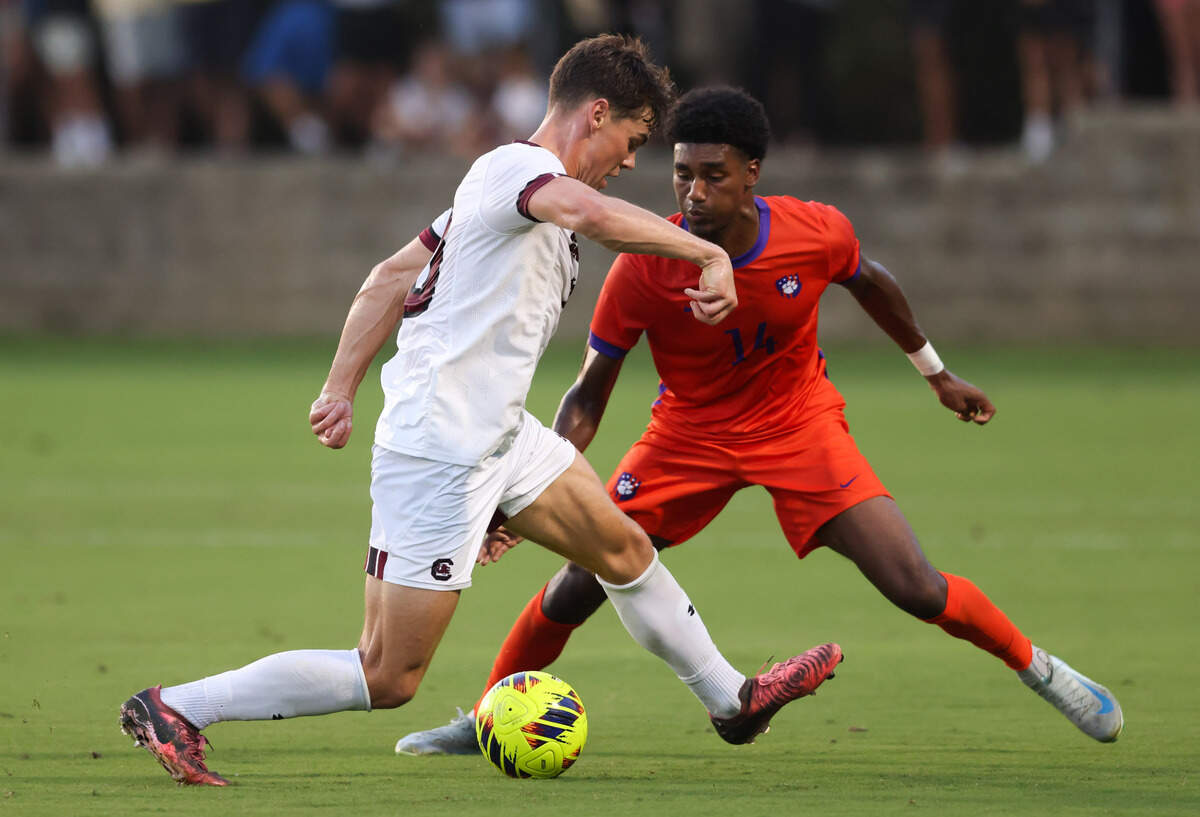 South Carolina forward Ethan Ballek (10) is defended by Clemson defender Titus Sandy Jr. (14) during the Gamecocks’ game against Tigers in Columbia on Friday, August 30, 2024.