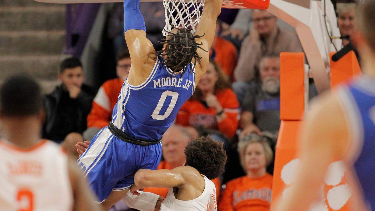 Duke forward Wendell Moore Jr. (0) is hit from behind by Clemson guard David Collins (13) during first-half action in Clemson, S.C. on Thursday, Feb. 10, 2022. Collins was ejected after the play.