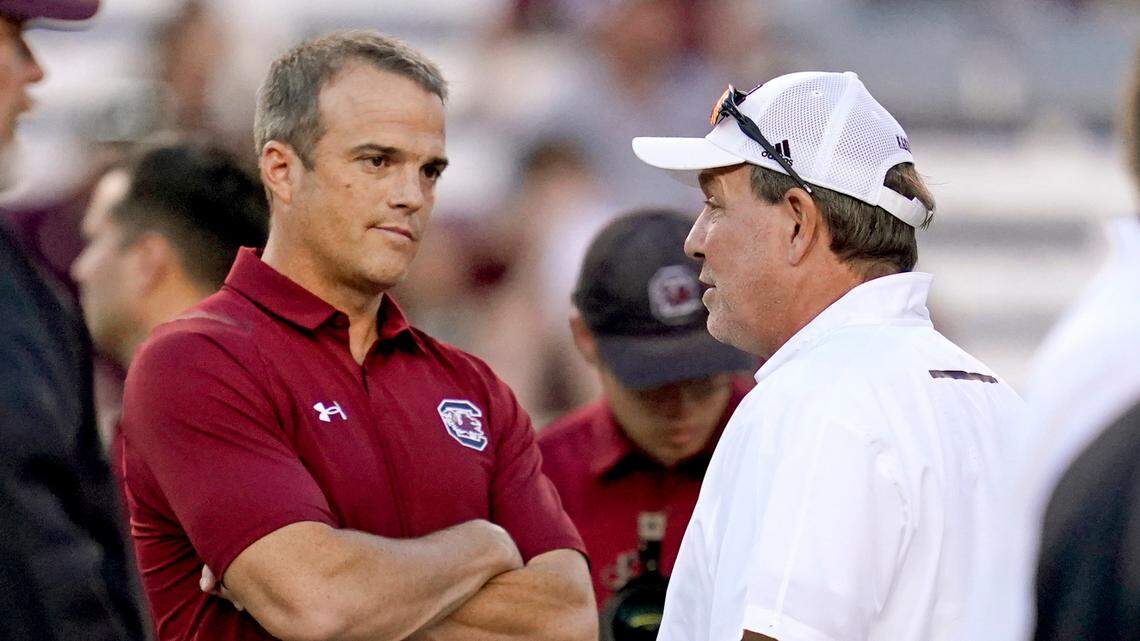 South Carolina head coach Shane Beamer, left, talks with Texas A&M head coach Jimbo Fisher before the start of an NCAA college football game on Saturday, Oct. 23, 2021, in College Station, Texas. (AP Photo/Sam Craft)