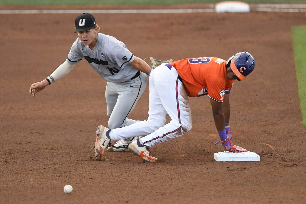 Clemson sophomore Jarren Purify (23) steals second under the tag of University of South Carolina Upstate sophomore Vance Sheahan (10) during the bottom of the first inning at the NCAA baseball Clemson Regional at Doug Kingsmore Stadium in Clemson, S.C. Friday, May 30, 2025.