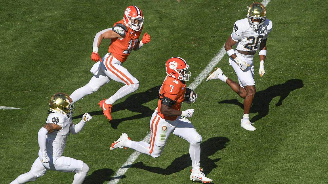 Nov 4, 2023; Clemson, South Carolina, USA; Clemson Tigers running back Phil Mafah (7) runs 41 yards for a touchdown against Notre Dame Fighting Irish corner back Benjamin Morrison (20) during the first quarter at Memorial Stadium. Mandatory Credit: Ken Ruinard-USA TODAY Sports