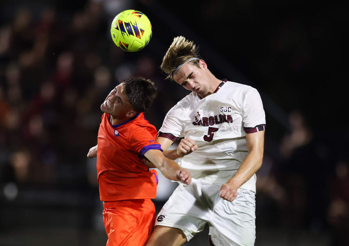South Carolina defender William Nilsson (5) and Clemson forward Tyler Trimnal (9) go up for a header during the Gamecocks’ game against Tigers in Columbia on Friday, August 30, 2024.