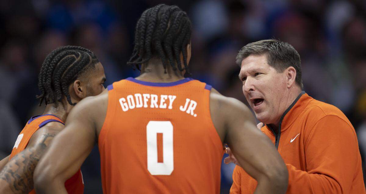 Clemson coach Brad Brownell talks with guard Dillon Hunter  and forward RJ Godfrey (0) in the first half against Duke on Friday, March 13, 2026, during the semifinals of the ACC Tournament at Spectrum Center in Charlotte, North Carolina.