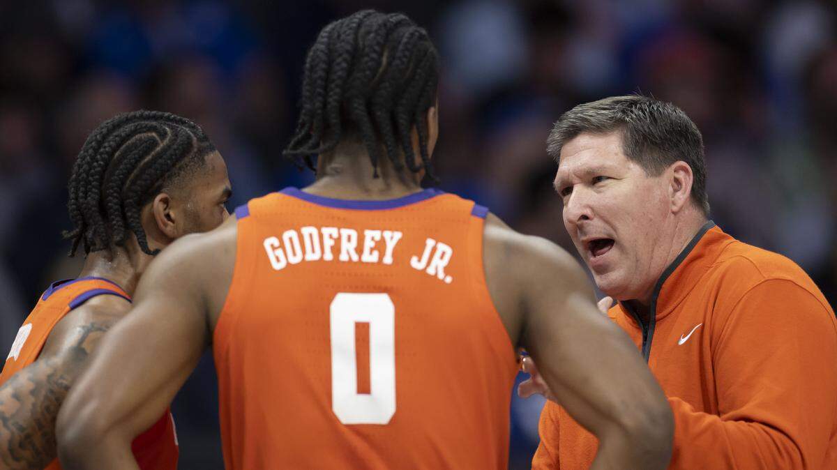 Clemson coach Brad Brownell talks with guard Dillon Hunter (2) and forward R J Godfrey (0) in the first half against Duke on Friday, March 13, 2026, during the semifinals of the ACC Tournament at Spectrum Center in Charlotte, N.C.
