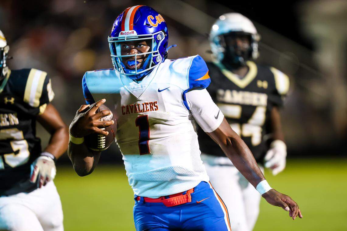 RNE quarterback Will Wilson (1) rushes for a touchdown against the Camden Bulldogs during their game at Camden High School Friday, 9/20/24.