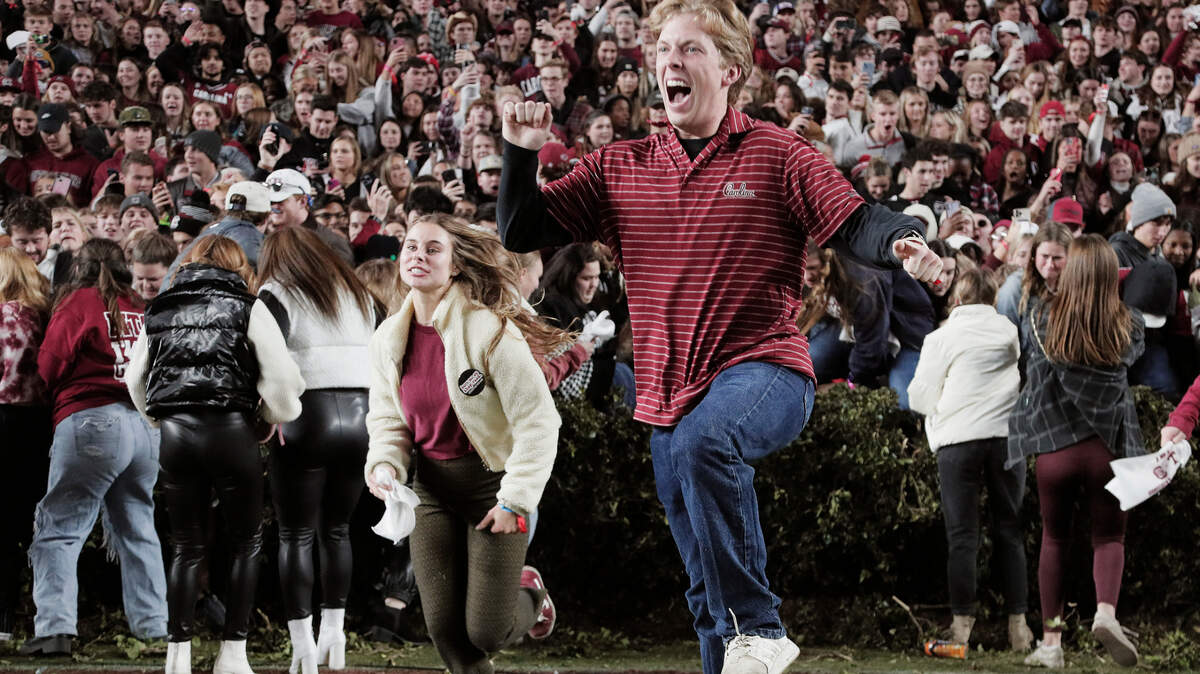 South Carolina fans rush the field after defeating Tennessee on Saturday, November 19, 2022.
