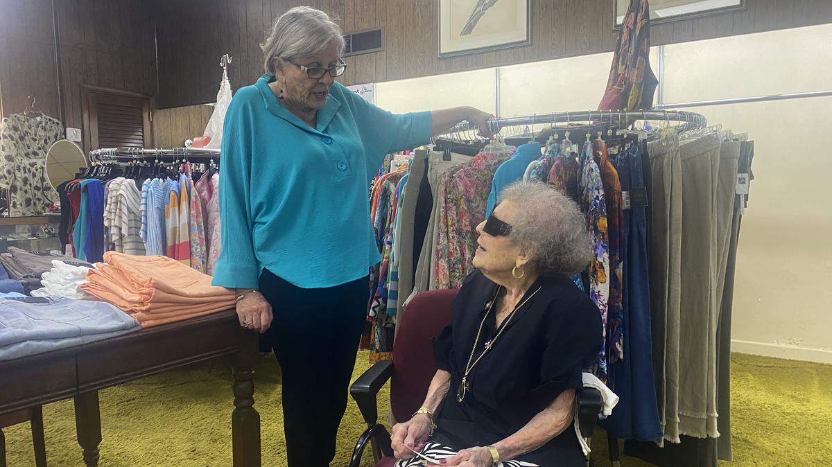 Mae Buzhardt, right, speaks with a customer at her store, Mae’s, which she’s operated since 1963.