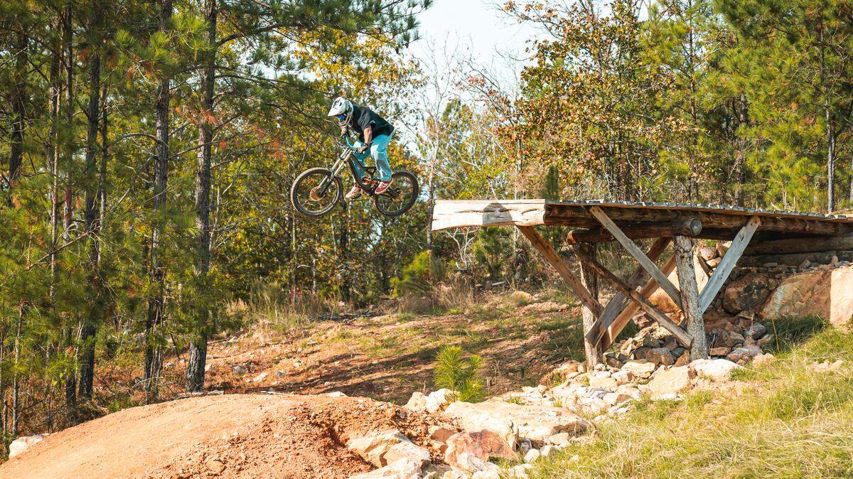 A rider takes a jump on opening day at Fairfield County’s Rattlesnake Bike Park. Nov. 16, 2024.