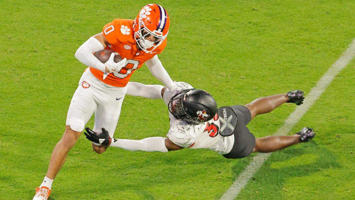 Clemson wide receiver Antonio Williams (0) pushes away from Louisville linebacker Antonio Watts (35) during first-half action in Clemson, S.C. on Saturday, Nov. 2, 2024.