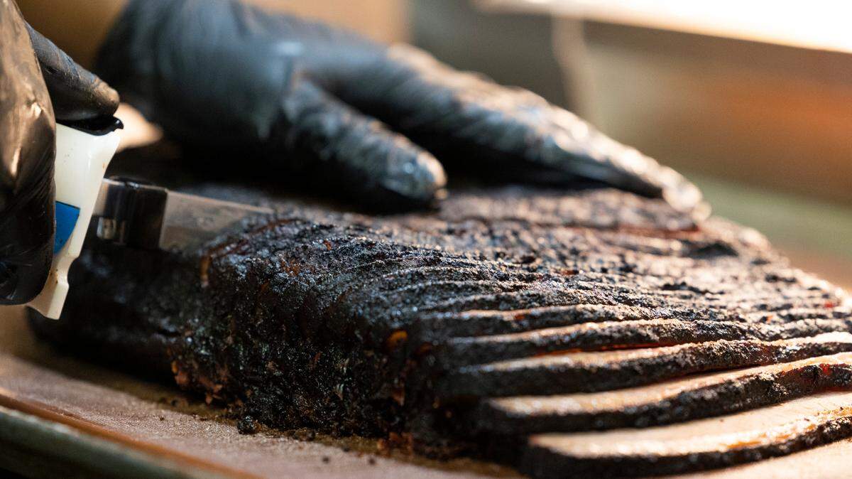 Brisket is sliced at Railroad BBQ in Columbia, South Carolina on Thursday, September 15, 2022. The restaurant is known for its unique fusion of different region’s barbecue styles.