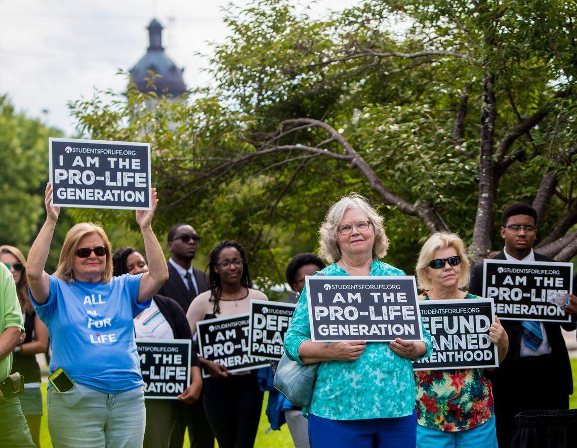 Pro-life supporters rally outside the Planned Parenthood Action Fund’s “We Decide: 2020 Election Membership Forum” at the USC Alumni Center in Columbia, SC.