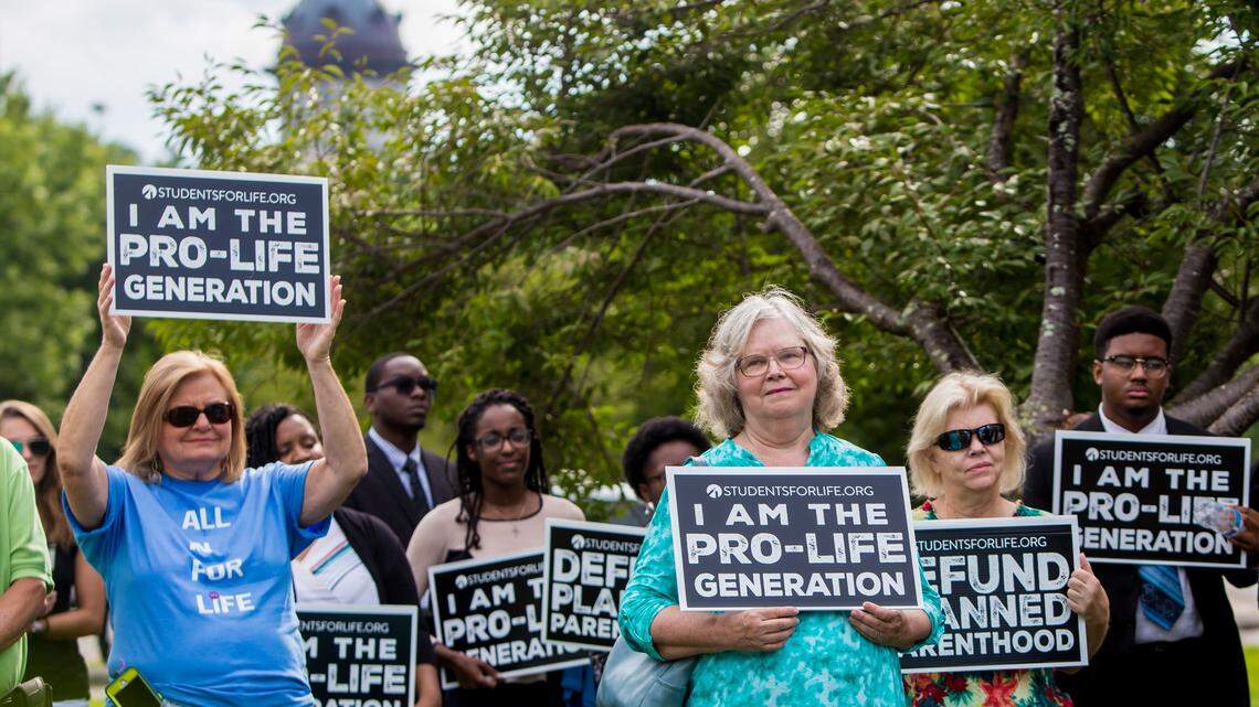 Pro-life supporters rally outside the Planned Parenthood Action Fund’s “We Decide: 2020 Election Membership Forum” at the USC Alumni Center in Columbia, SC.