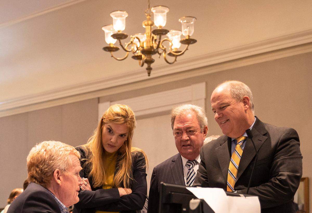 From left, Alex Murdaugh, Maggie Fox, Dick Harpootlian and Jim Griffin talk while on a break in Alex Murdaugh’s trial for murder at the Colleton County Courthouse on Friday, February 10, 2023. Andrew J. Whitaker/The Post and Courier/Pool