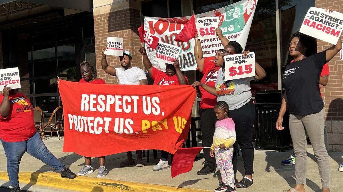 Workers at MOD Pizza picketed the Pelham Drive store Friday in Columbia.