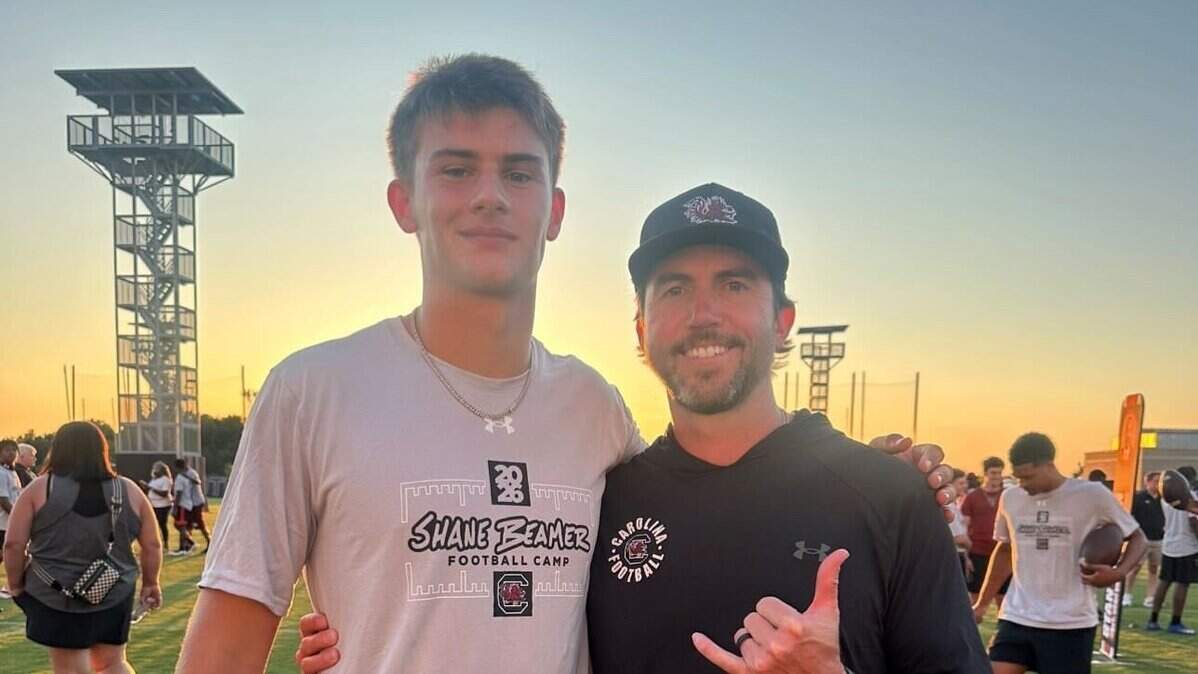 Class of 2027 QB recruit Luke Gaither (left) and South Carolina football offensive coordinator Kendal Briles (right) at a USC camp