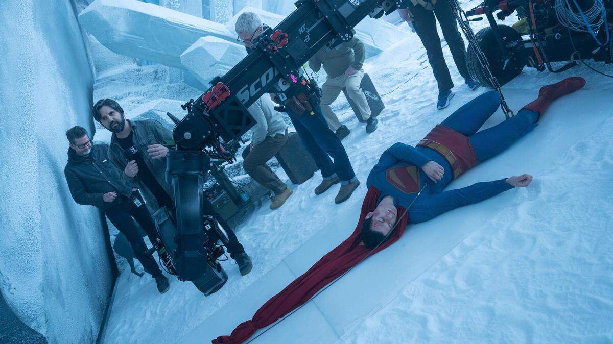 Assistant director Ed Tilden (left front) prepares to to roll on a shot of David Corenswet’s Superman being dragged to the Fortress of Solitude door by Krypto the Superdog.