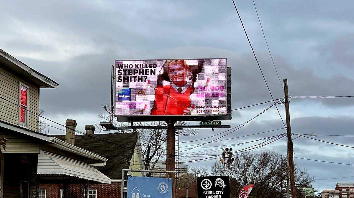 A billboard on Taylor Street advertises a $30,000 reward for information into the mysterious death of Stephen Smith, who was found dead on a rural Hampton County Road in 2015.