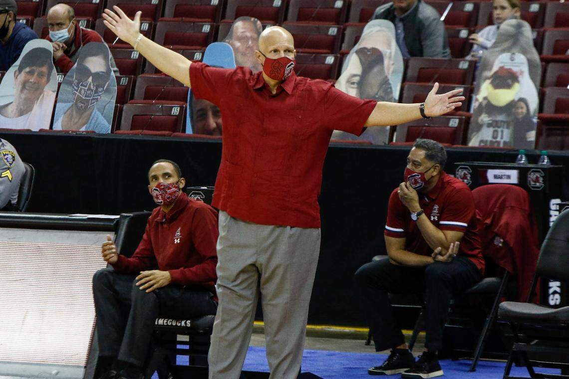 South Carolina basketball coach Frank Martin during the Gamecocks’ January game against Florida A&M. Seated are assistants Bruce Shingler, left, and Chuck Martin.