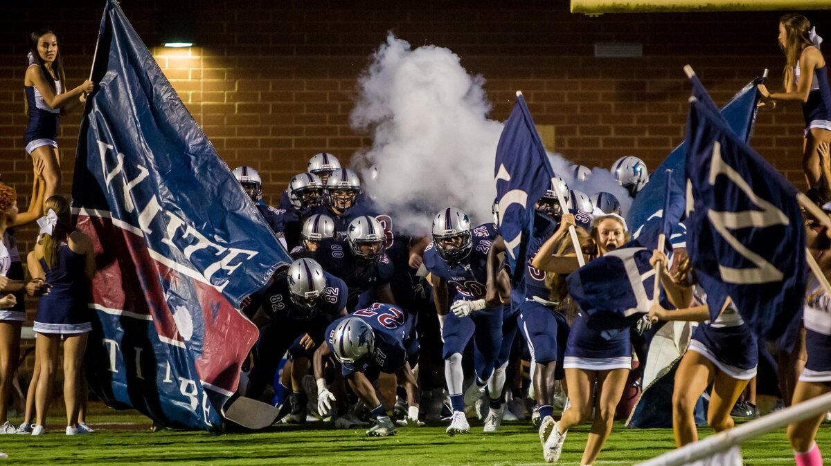 White Knoll Timberwolves players enter the field before the game between Lexington High School at White Knoll High School.