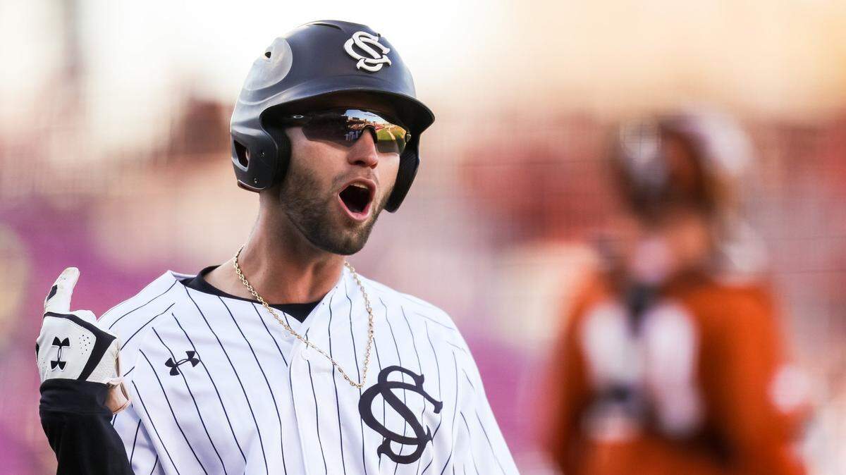 South Carolina Gamecocks infielder Brandt Belk (13) celebrates after scoring against the Texas Longhorns during the second game game of their double header at Founders Park Sunday, March 13, 2022.