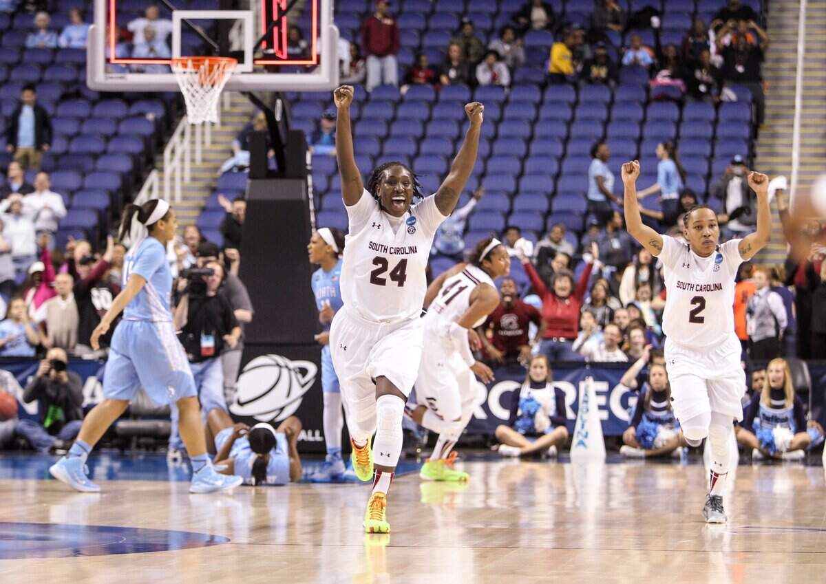 From March 27, 2015: South Carolina forward Aleighsa Welch (24) and guard Olivia Gaines (2) celebrate beating North Carolina during the second half of action in the NCAA Division 1 regional at the Greensboro Coliseum.