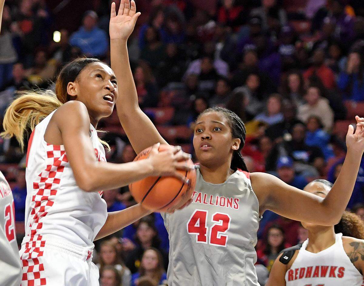 Westwood’s Nyah Leveretter battles against South Pointe’s Makayla Jamerson (42). Westwood faced South Pointe in the Class 4A Girls Upper State championship game on Feb. 22, 2019 at Bon Secours Wellness Arena in Greenville. GWINN DAVIS / For The State