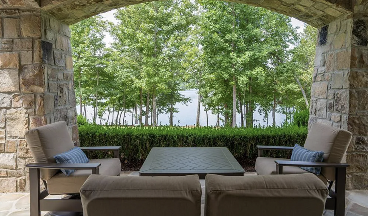 The house has several porches and outside sitting areas.