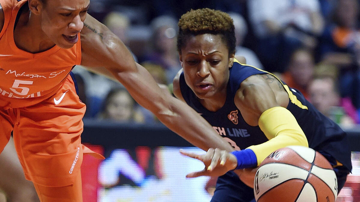 Connecticut Sun guard Jasmine Thomas (5) battles Indiana Fever guard Tiffany Mitchell for a loose ball during the first half of a WNBA basketball game Saturday, May 26, 2018, in Uncasville, Conn.