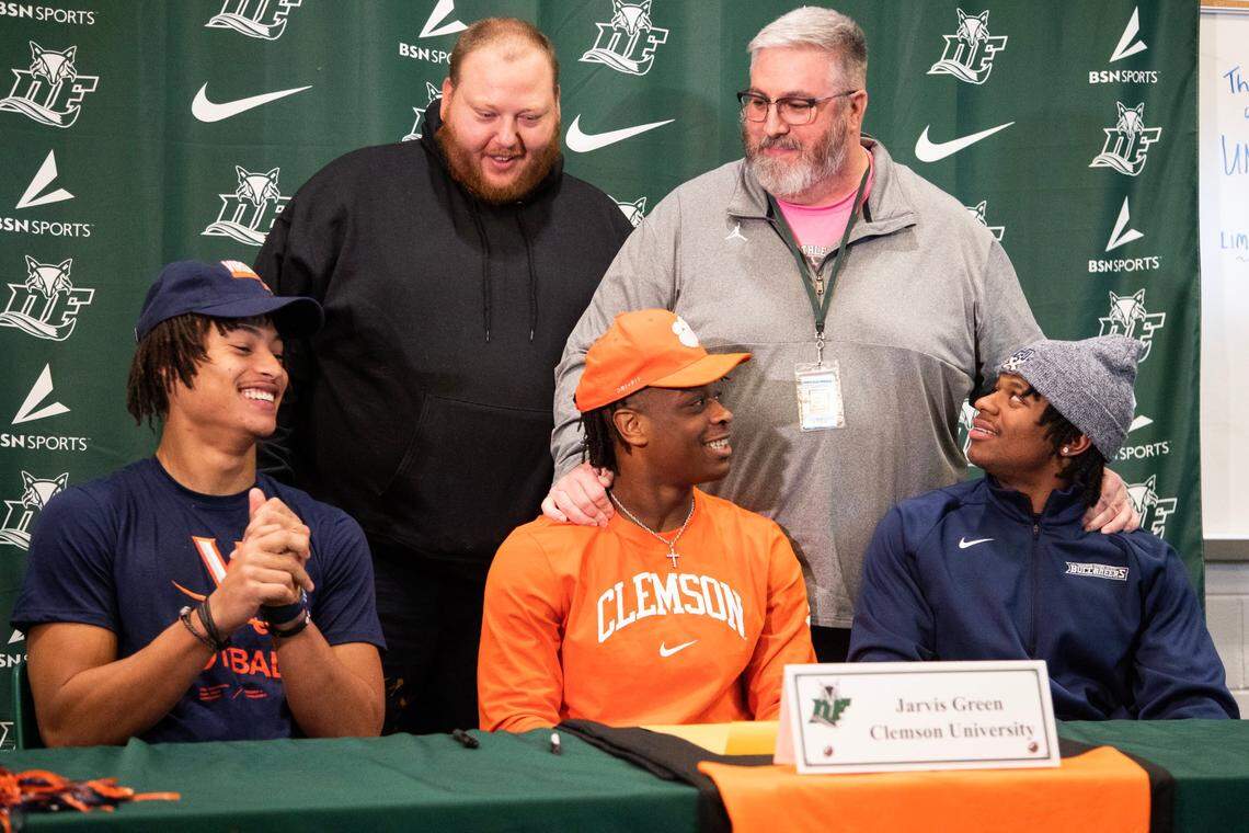 Dutch Fork players, from left, who signed with their respective colleges Wednesday were Landon Danley (Virginia), Jarvis Green (Clemson) and Chandler Perry (Charleston Southern).