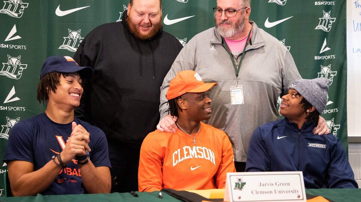 Dutch Fork players, from left, who signed with their respective colleges Wednesday were Landon Danley (Virginia), Jarvis Green (Clemson) and Chandler Perry (Charleston Southern).