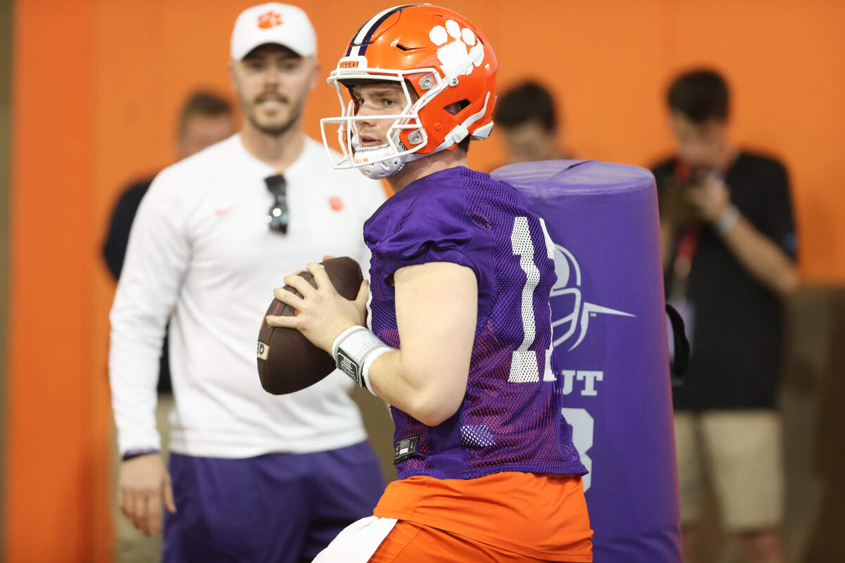 Clemson offensive coordinator Garret Riley (L) and quarterback Christopher Vizzina (17) during spring practice in Clemson on March 6 , 2023