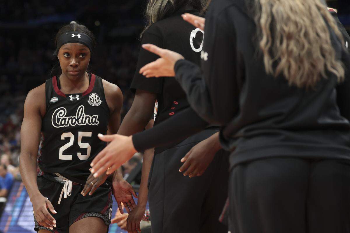 South Carolina's Raven Johnson (25) walks off the court for the last time as a Gamecock during the national championship game Sunday against UCLA.