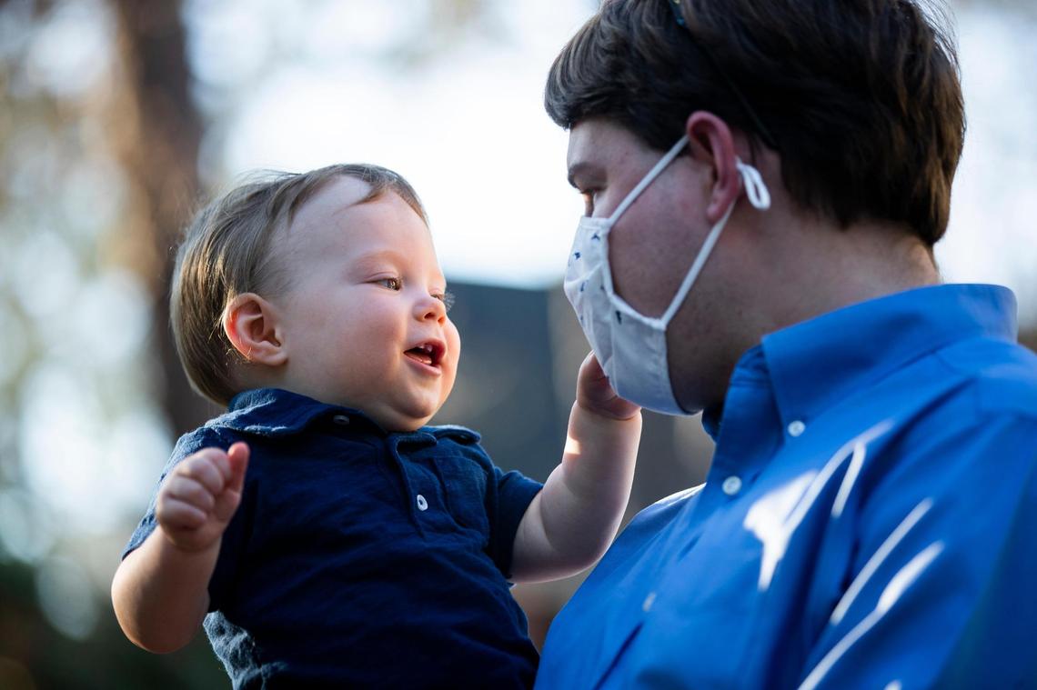 Hugo Bancroft tries to remove Bryce Bancroft’s mask at their home on Thursday, February 25, 2021. Hugo has lived most of his life during the coronavirus pandemic, and enjoys trying to remove his parent’s masks.