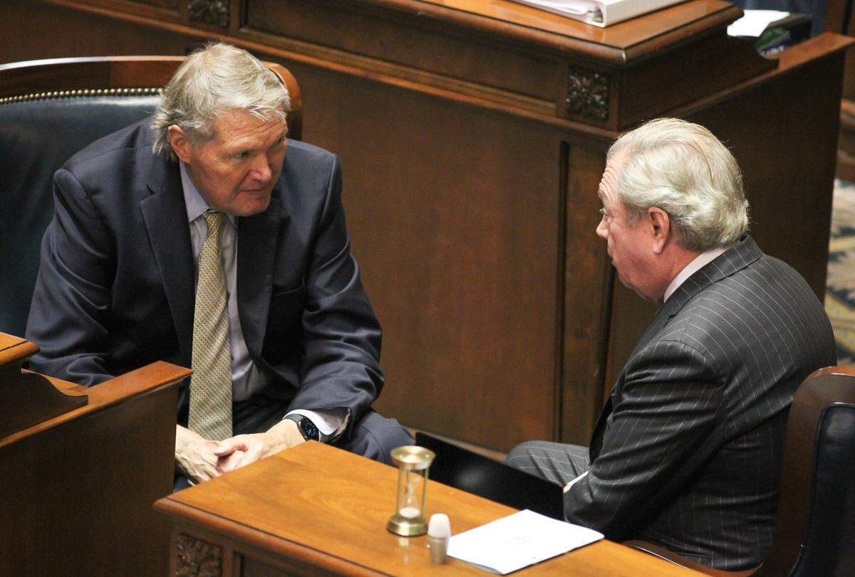 State Sen. Harvey Peeler, left, and state Sen. Dick Harpootlian talk during session in Columbia, S.C. on Wednesday, March 23, 2022. Peeler this year is leading the budget process in the Senate for the first time. (Travis Bell/STATEHOUSE CAROLINA)
