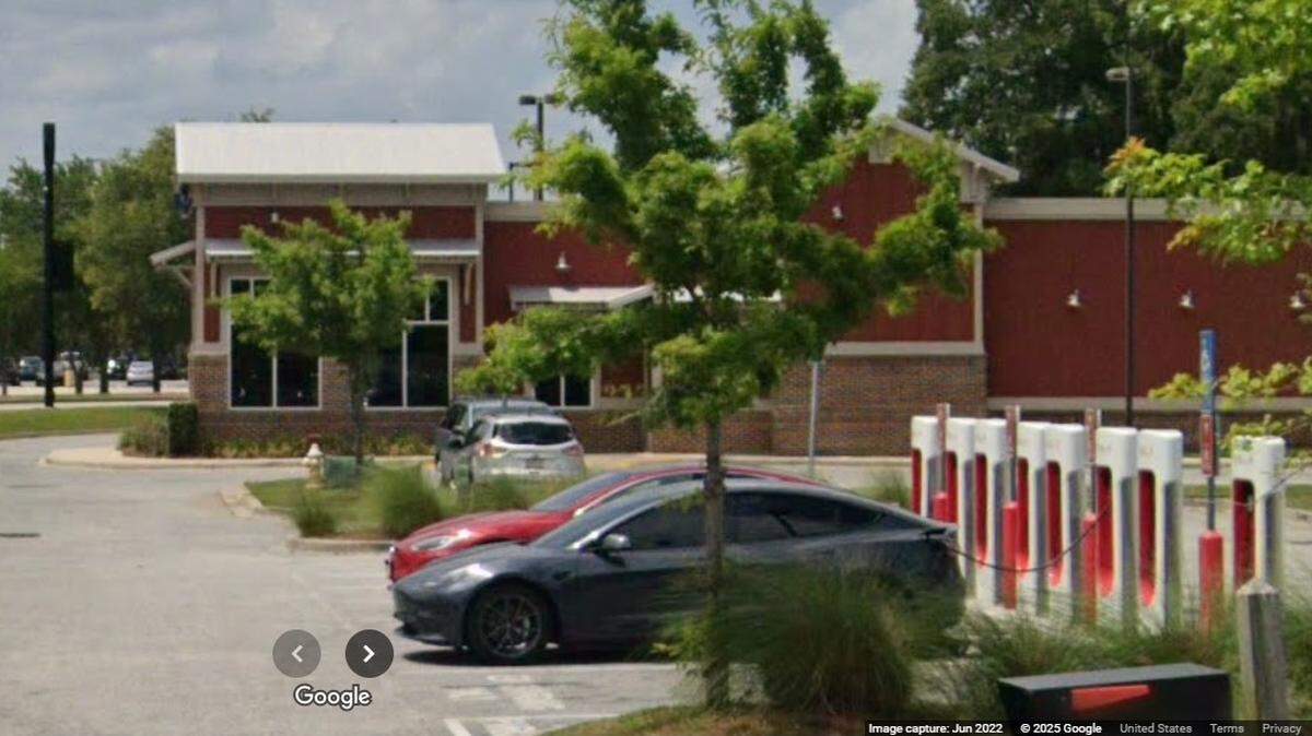 A man set three Tesla charging stations on fire outside of a restaurant in South Carolina, police said.
