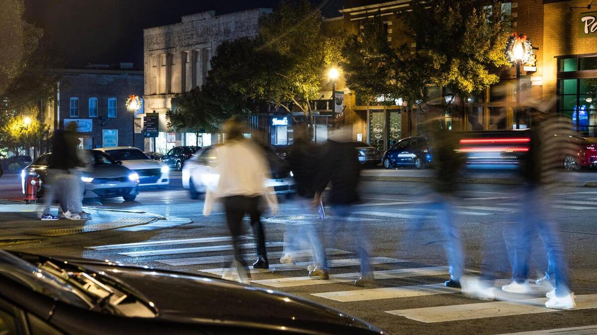 Students, locals and visitors walk from club to club in the Vista neighborhood in Columbia, South Carolina on Friday, November 18, 2022. Students and business owners have noticed a shift in Colubmia’s nightlife scene.