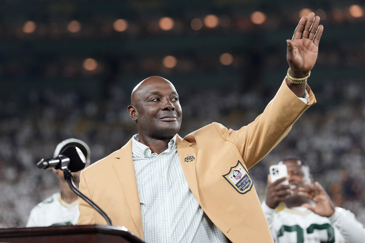 Former USC wide receiver and Pro Football Hall of Famer Sterling Sharpe speaks during a ring ceremony during halftime of a 2025 Green Bay Packers game.